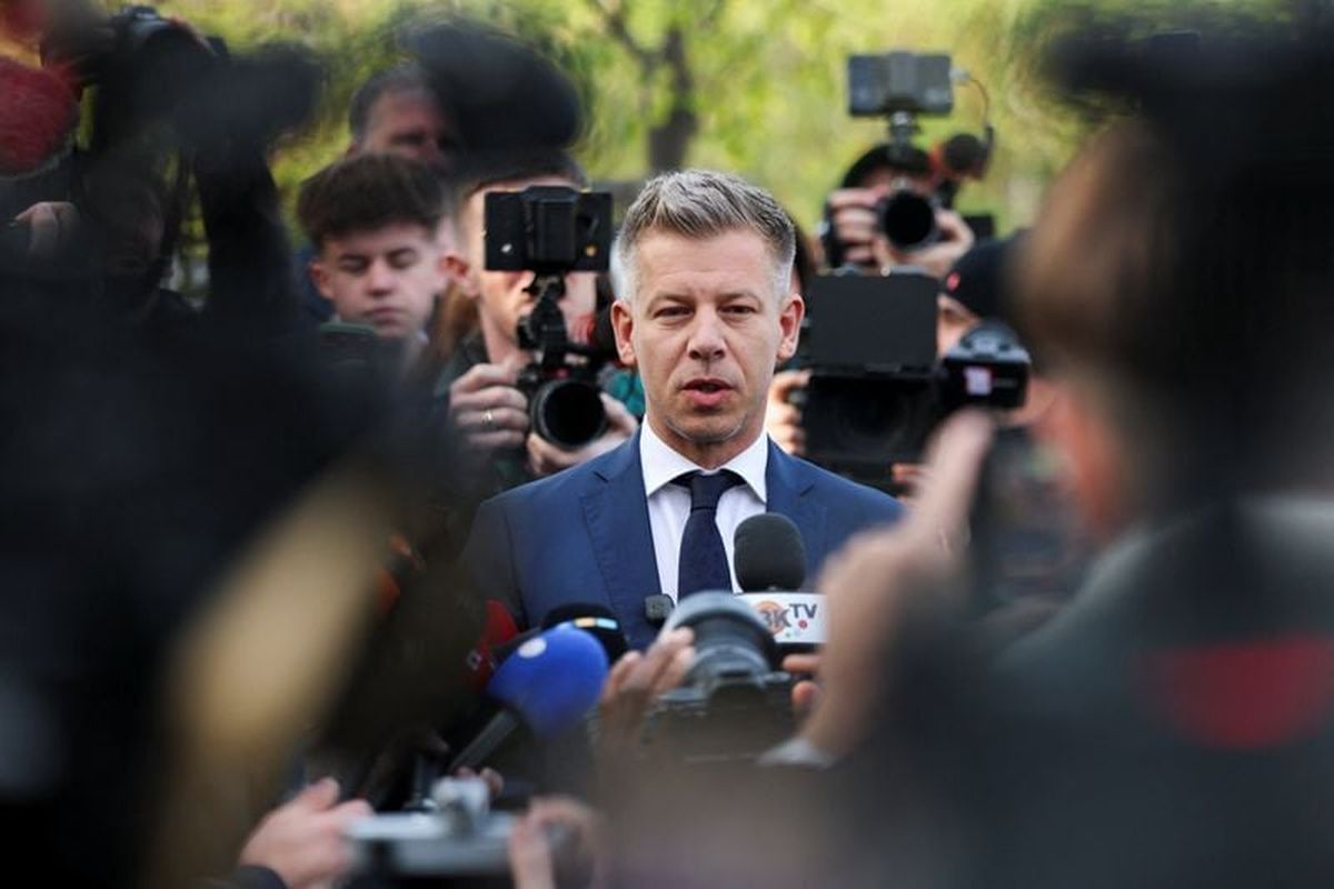 Peter Magyar, leader of the opposition Tisza party, speaks to the media after voting during the Hungarian parliamentary election on Sunday in Budapest, Hungary. (Reuters )