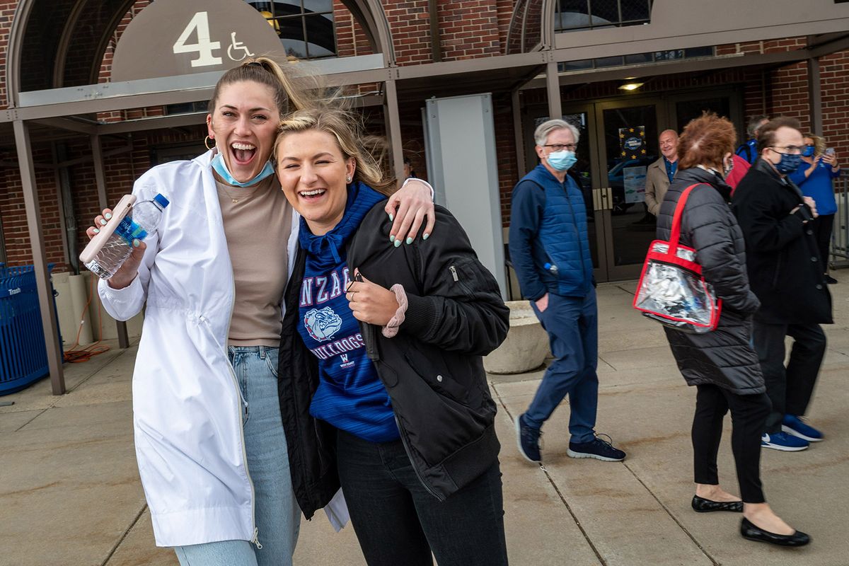 Former Gonzaga women’s basketball teammates Elle Tinkle, left, and Laura Stockton were all smiles after the Zags defeated Creighton 83-65 Sunday in Indianapolis.  (COLIN MULVANY/THE SPOKESMAN-REVIEW)