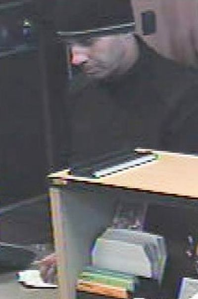 Bank surveillance video capture the picture of a man who robbed the Spokane Teachers Credit Union branch on Indian Trail Road on Friday, April 23, 2010.