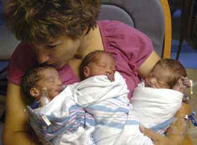 
Victoria Lasita  and her second set of triplets  on Thursday. From left are, Casey, Carson and Caden, all born Wednesday. Associated Press
 (Associated Press / The Spokesman-Review)
