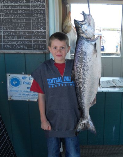 Eight-year-old Jared Clark of Veradale topped all anglers in the weekly Ilwaco king salmon derby with a fish he landed on July 1, 2011, while fishing off the Washignton Coast with Captain Rob Gudgell of the Katie Marie booked through Pacific Salmon Charters. The king salmon weighed 21.90 pounds after it was cleaned.
 (Courtesy photo)
