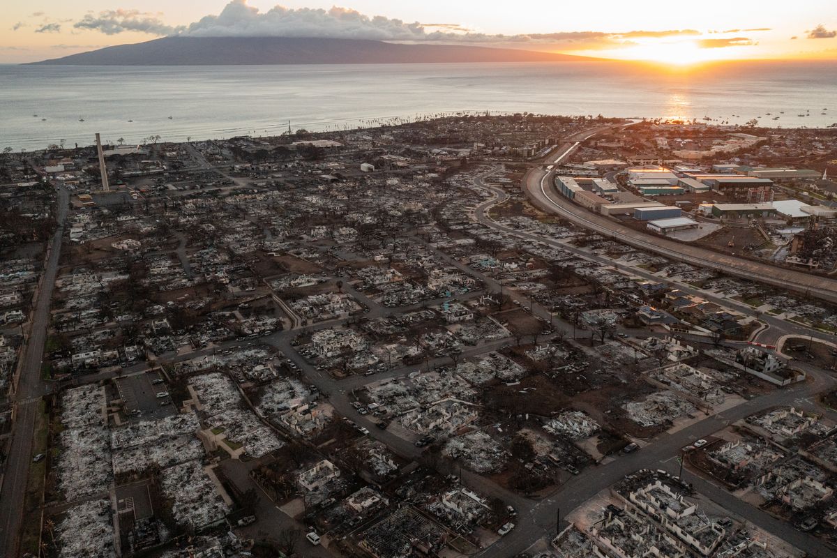 Remnants of homes and vehicles are seen in a neighborhood that was destroyed in Lahaina during August 2023 wildfires.   (Tamir Kalifa/For The Washington Post)