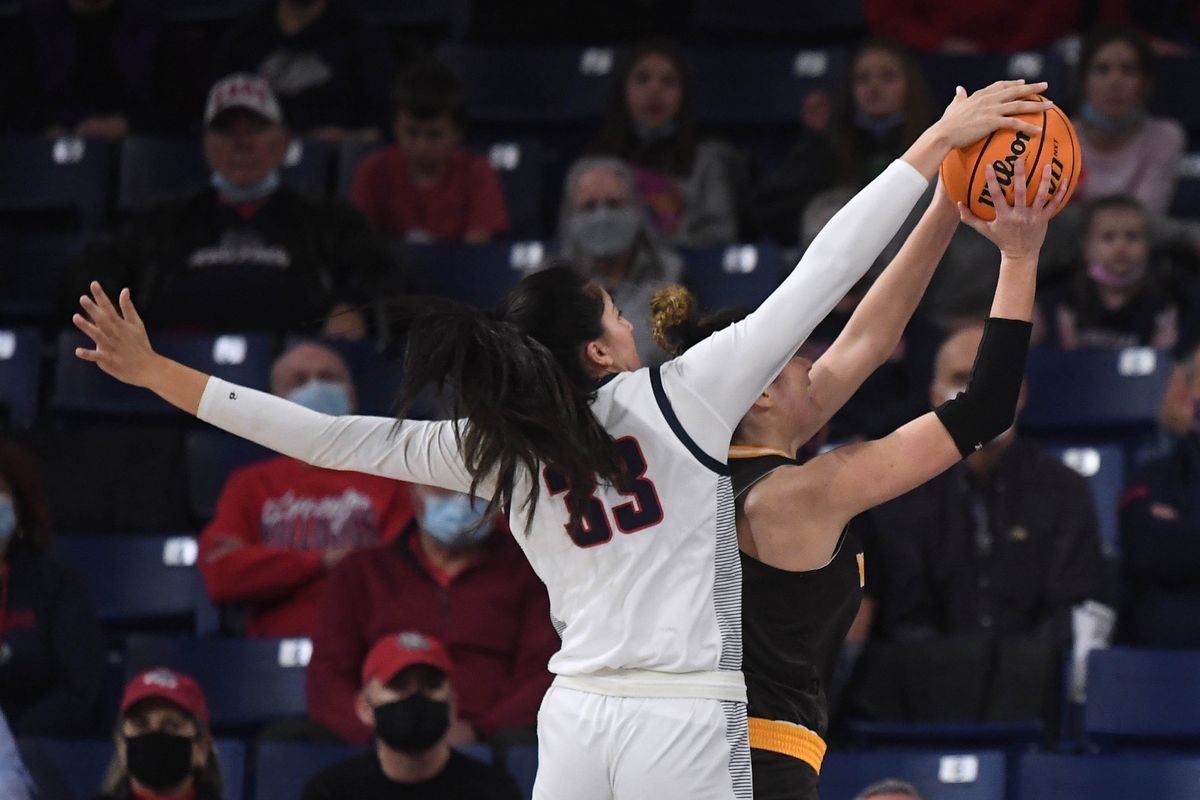 Gonzaga forward Melody Kempton (33) blocks a shot by Wyoming guard Alba Sanchez Ramos (11) during the first half of a college basketball game, Friday, Dec. 3, 2021, in the McCarthey Athletic Center.  (COLIN MULVANY/THE SPOKESMAN-REVIEW)