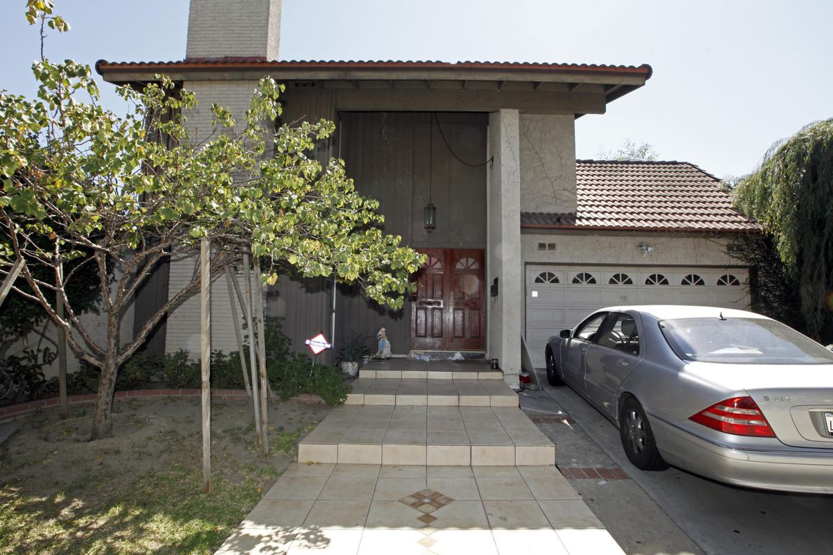 A car sits parked at the suburban Los Angeles home believed to be that of filmmaker Nakoula Basseley Nakoula, Friday, Sept. 14, 2012. Federal authorities have identified Nakoula, a self-described Coptic Christian, as the key figure behind "Innocence of Muslims," a film denigrating Islam and the Prophet Muhammad that ignited mob violence against U.S. embassies across the Middle East. (Reed Saxon / Associated Press)