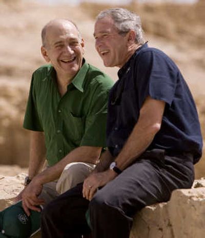 
President  Bush and Israeli Prime Minister Ehud Olmert share a laugh Thursday at the historic fortress of Masada in Israel. Associated Press
 (Associated Press / The Spokesman-Review)