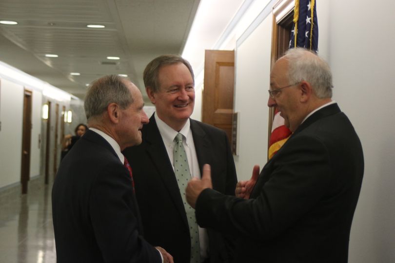 Judge David Nye, left, talks with Sens. Jim Risch, left, and Mike Crapo, center, outside the Senate Judiciary Committee's hearing room on Tuesday