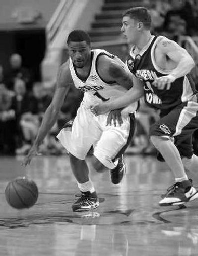 
Nevada's Lyndale Burleson, left, drives past Northern Iowa guard Jared Josten during the first half. 
 (Associated Press / The Spokesman-Review)