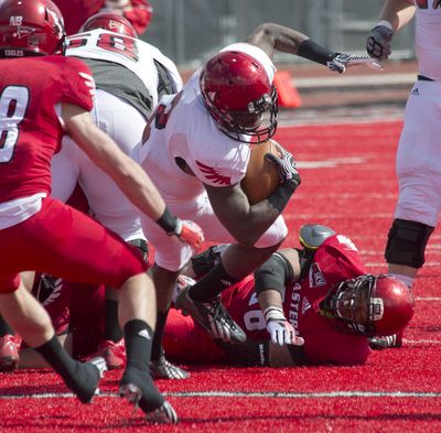 Eastern Washington's Jabari Wilson, fighting for yards in last season’s Red-White spring game, is the only experienced back returning for the Eagles. (Dan Pelle / The Spokesman-Review)