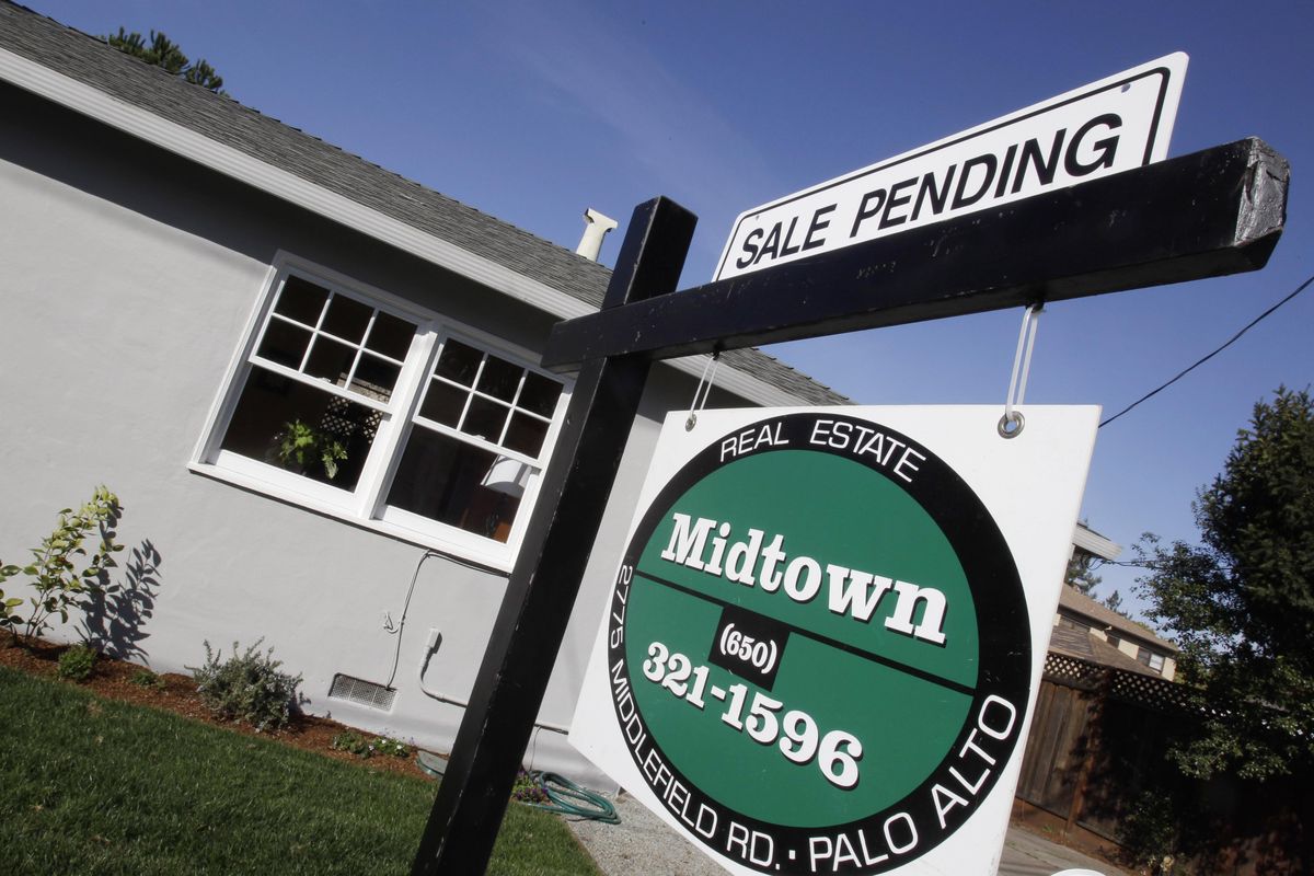 A home with a pending home sale sign is shown in Palo Alto, Calif., in 2011. (Paul Sakuma / AP)