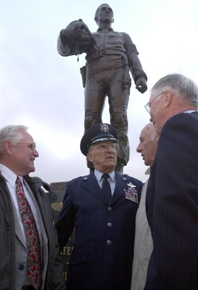 Retired Brig. Gen. J. Robinson Risner, center, stands in front of the statue honoring him at the Air Force Academy in 2001. (File)