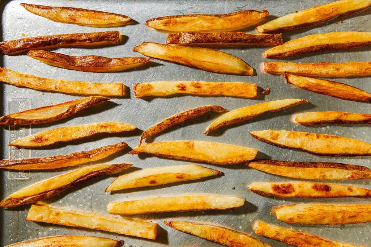 Oven fries can be the basis of a fun, filling meal.  (Photos by Rey Lopez; food styling by Lisa Cherkasky/For The Washington Post)