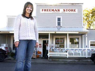 
Barb Lang  poses in front of the Freeman Store. Lang and her husband, Craig Lang, bought the store about 18 months ago. They have added a deli and are building a drive-through espresso stand behind the building. 
 (Joe Barrentine / The Spokesman-Review)