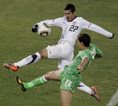 United States' Benny Feilhaber, back, competes for the ball with Algeria's Karim Matmour, front, during the  World  Cup group C soccer match between the United  States and Algeria on June 23, 2010. (Associated Press)