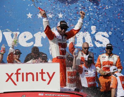 Kyle Larson celebrates with his crew in Victory Lane after winning a NASCAR Xfinity Series auto race at Chicagoland Speedway in Joliet, Ill., Saturday, June 30, 2018. (Nam Y. Huh / Associated Press)
