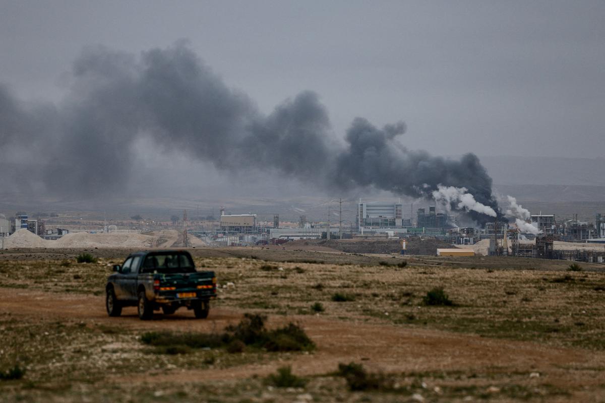 Smoke rises Sunday following an Iranian missile strike in southern Israel as the U.S.-Israeli conflict with Iran continues.  (Reuters)