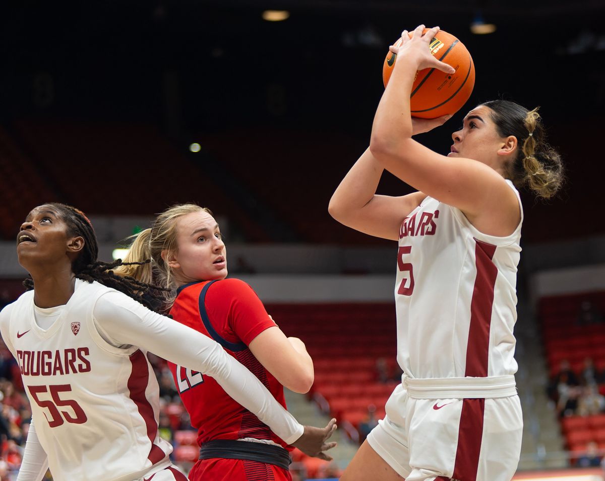 Washington State guard Charlisse Leger-Walker, right, puts up a shot while center Bella Murekatete, left, guards Gonzaga guard Brynna Maxwell in the first half on Thursday, Oct. 9, 2023, at Beasley Coliseum in Pullman, Wash.  (Geoff Crimmins/The Spokesman-Review)