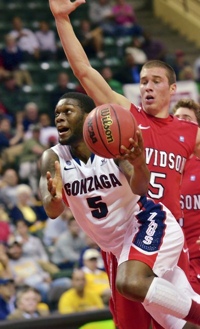 GU’s Gary Bell Jr. drives past Davidson’s JP Kuhlman. (Associated Press)
