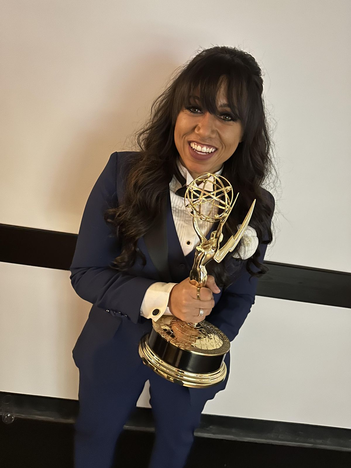 Mandi Price holds an Emmy that was awarded to the music production team of “Daisy Jones and the Six.”  (Courtesy)