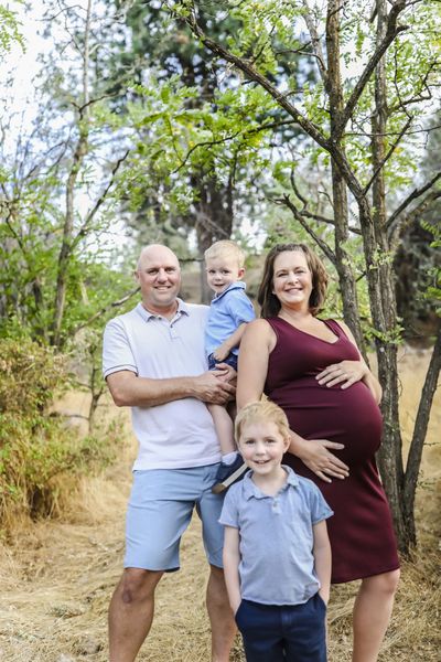 Kyla Scott, shown here with her husband, Travis, and their two children before their third was born, has always attended church in the denomination in which she grew up – the Wisconsin Evangelical Lutheran Synod. It’s an important way for her to maintain a sense of tradition and connection to her family. Travis has now been baptized, and they attend The Vine Church in Hayden with their children regularly.  (Courtesy of the Scott family)