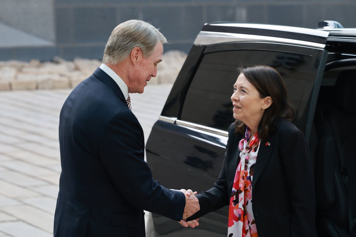 David Perdue, U.S. ambassador to China, shakes hands with Sen. Maria Cantwell, D-Wash., as she arrives in Beijing on May 6 for meetings with Chinese leaders.  (Courtesy of Sen. Maria Cantwell