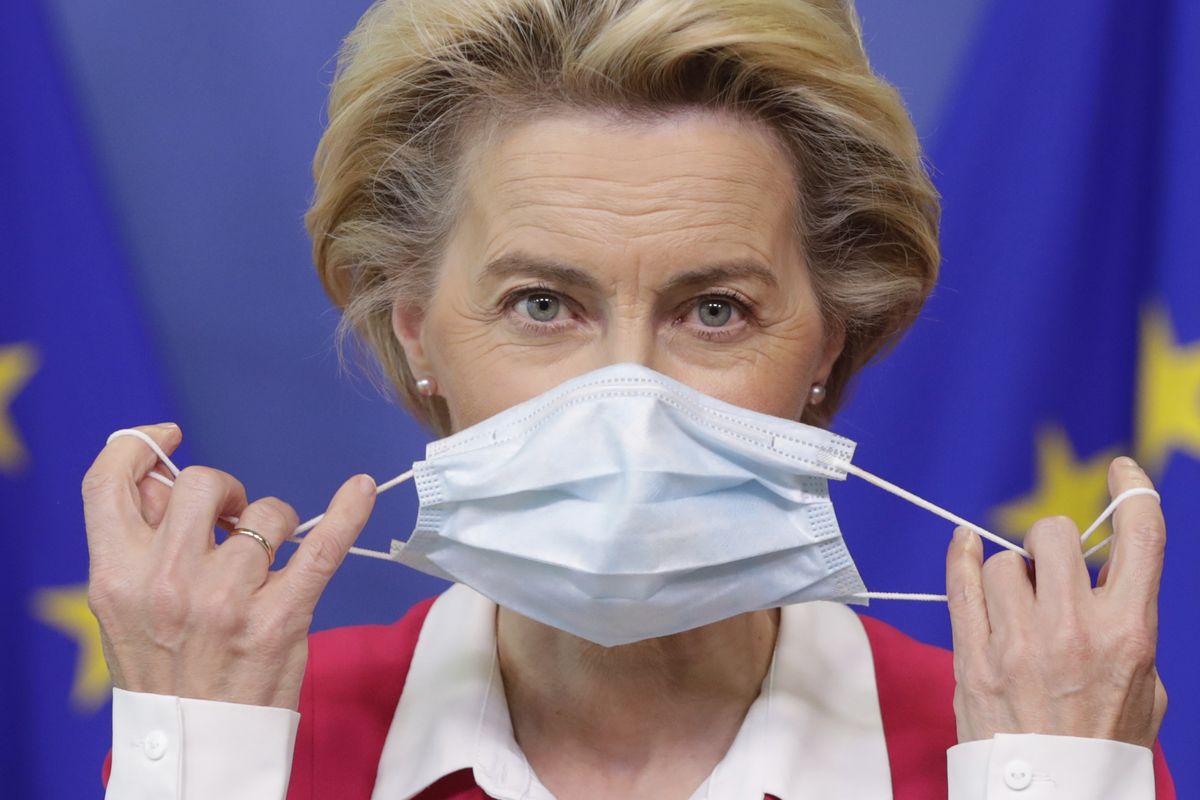 European Commission President Ursula von der Leyen removes her face mask before giving a statement at the European Commission headquarters in Brussels, Wednesday, Sept. 23, 2020.  (Stephanie Lecocq)