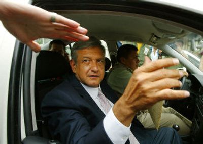 
Democratic Revolutionary Party presidential candidate Andres Manuel Lopez Obrador greets a supporter as he leaves his headquarters office Tuesday in Mexico City. 
 (Associated Press / The Spokesman-Review)