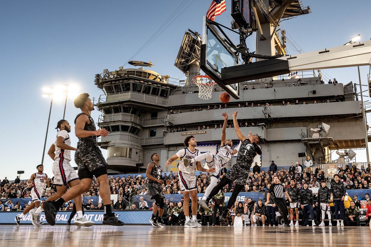 Gonzaga guard Nolan Hickman (11) breaks up a shot by Michigan State guard Pierre Brooks (1) during the first half of the Armed Forces Classic college basketball game held on the flight deck of the USS Abraham Lincoln aircraft carrier, Friday, Nov. 11, 2022, in San Diego.  (COLIN MULVANY/THE SPOKESMAN-REVIEW)