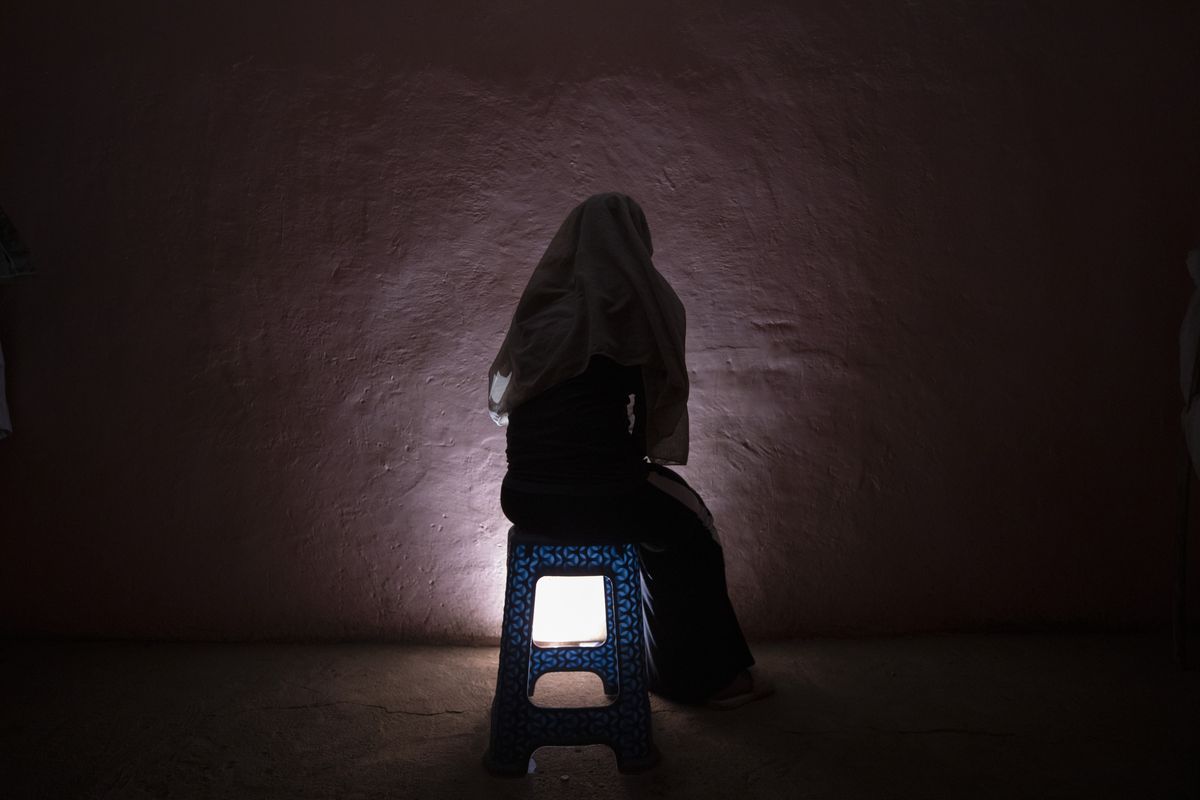 FILE - In this March 20, 2021 file photo, a Tigrayan refugee rape victim who fled the conflict in Ethiopia's Tigray sits for a portrait in eastern Sudan near the Sudan-Ethiopia border. A new Amnesty International report published Wednesday, Aug. 11, 2021 says dozens of women have described shocking sexual assaults by Ethiopian soldiers and allied forces in the country's Tigray conflict, and its researcher calls it striking how the perpetrators appeared to act without fear of punishment from their commanders.  (Nariman El-Mofty)