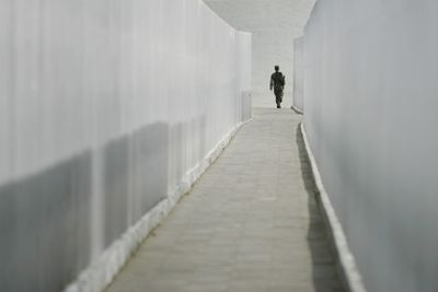 A Mexican soldier walks near a U.S.-Mexico border crossing in Ciudad Juarez, Mexico, on Friday.  (Associated Press / The Spokesman-Review)