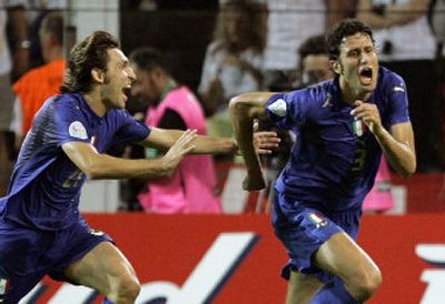 
Italy's Fabio Grosso, right, celebrates with teammate Andrea Pirlo after scoring the first goal in the extra time of the World Cup semifinal against Germany.
 (Associated Press / The Spokesman-Review)