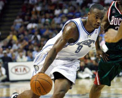 
Rashard Lewis drives to the basket on his way to a game-high 26 points during the Magic's win over the Bucks.Associated Press
 (Associated Press / The Spokesman-Review)