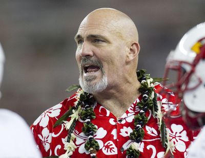 Lamar assistant coach Dennis McKnight speaks to his team during a timeout in the second quarter of the NCAA game between the Lamar and Hawaii, Sept. 15, 2012 in Honolulu.  (Associated Press)