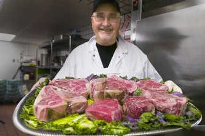 
Meatcutter Bob Fish holds a platter of the fresh cuts he prepares daily at Churchill's Steakhouse, which opened recently in downtown Spokane. 
 (Christopher Anderson photos / The Spokesman-Review)