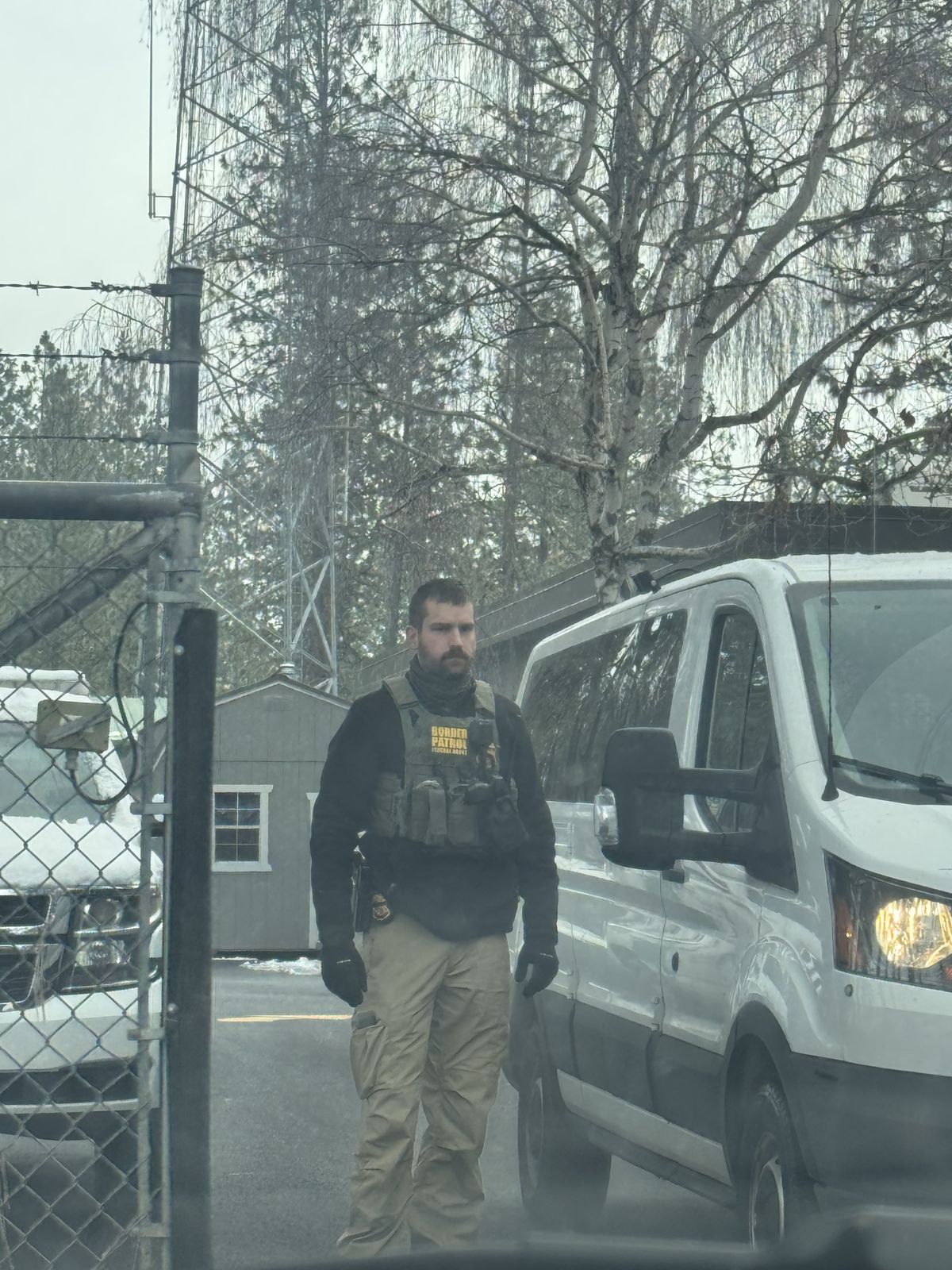 A Border Patrol agent waits for Arnoldo Tiul Caal and his daughter at their Spokane headquarters before transporting them to a Texas detention center on Jan. 9.  (Courtesy Olga Lucia Herrera)