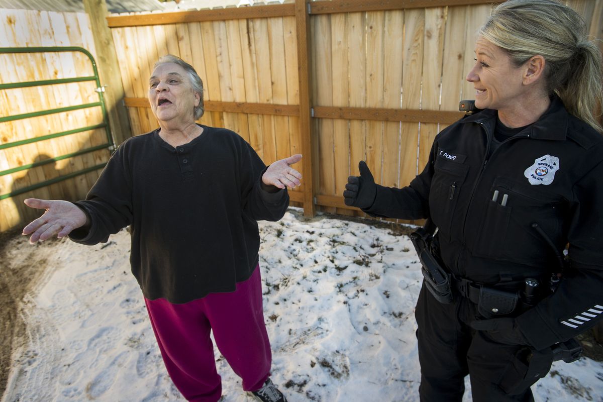 Pam Silva sings the praises of Spokane police Officer Traci Ponto, who donated her time and materials to build a fence in Silva’s backyard to thwart burglars who have regularly targeted her garage and home in Spokane’s West Central neighborhood. (Colin Mulvany)