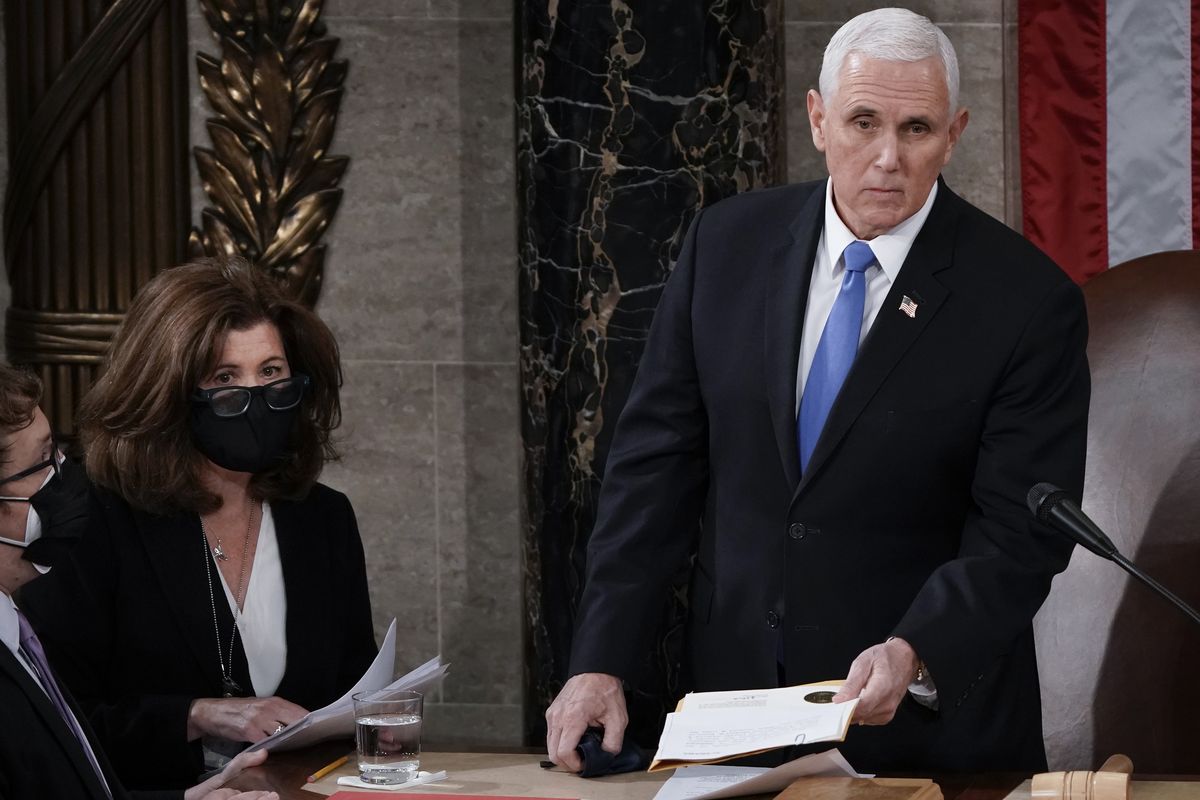 In this Jan. 6, 2021, photo, Senate Parliamentarian Elizabeth MacDonough, second from left, works beside Vice President Mike Pence during the certification of Electoral College ballots in the presidential election, in the House chamber at the Capitol in Washington. Shortly afterward, the Capitol was stormed by rioters determined to disrupt the certification. MacDonough has guided the Senate through two impeachment trials, vexed Democrats and Republicans alike with parliamentary opinions and helped rescue Electoral College certificates from a pro-Trump mob ransacking the Capitol.  (J. Scott Applewhite)