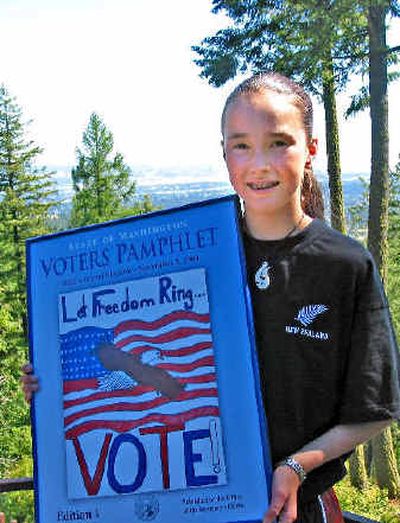 
Hannah Myers, 11, displays her winning artwork that will be on the cover of this year's Washington State Voters Pamphlet. 
 (Kandis Carper / The Spokesman-Review)
