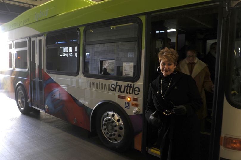 STA CEO Susan Meyer steps off a new hybrid bus Monday. The 29-foot coaches are fuel efficient and will cost less to maintain. (Jesse Tinsley / The Spokesman-Review)