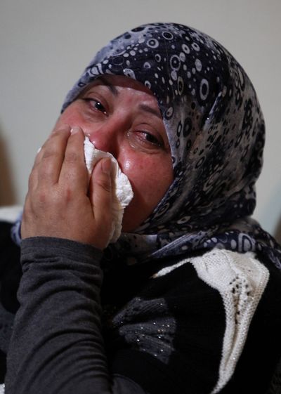 A relative in Beirut mourns for Ali Shaaban, a television cameraman working for Al Jadeed TV who was shot dead on the Lebanon-Syria border Monday. (Associated Press)