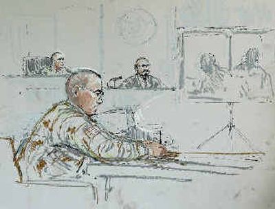 
Spc. Ryan G. Anderson, 26, takes notes Wednesday during his Article 32 hearing to determine if he should be court-martialed. Spc. Ryan G. Anderson, 26, takes notes Wednesday during his Article 32 hearing to determine if he should be court-martialed. 
 (Associated PressAssociated Press / The Spokesman-Review)