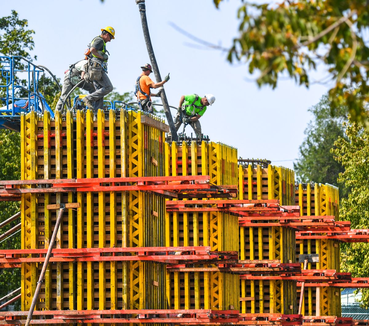 Crews from Hamilton Construction pour concrete columns for the North Spokane Corridor Skyway in the Spokane Community College parking lot near the corner of Greene Street and Ermina Avenue on Wednesday.  (DAN PELLE/THE SPOKESMAN-REVIEW)