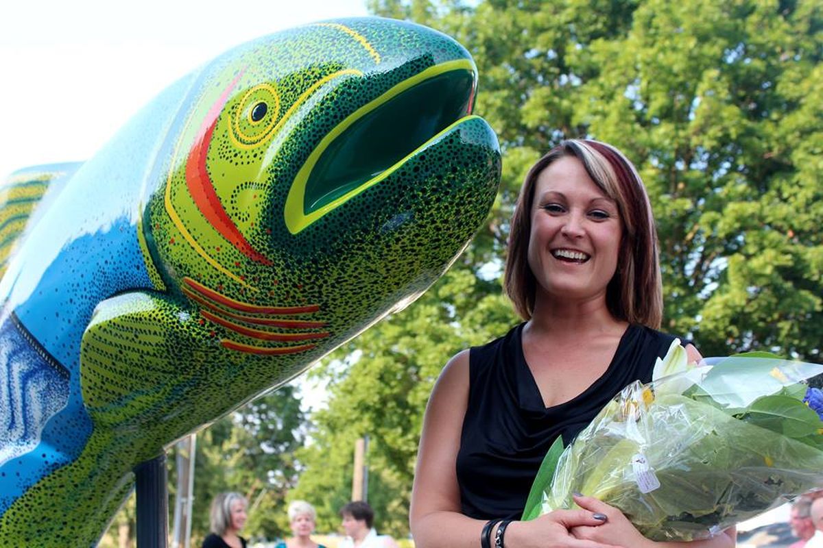 Artist Harmony Oaks celebrating the unveiling of the public art she was commissioned to paint. It was unveiled last evening at Jacklin Arts & Cultural Center in Post Falls and now is in place at the Spokane Street entrance to Post Falls. (Kerri Thoreson / Facebook)