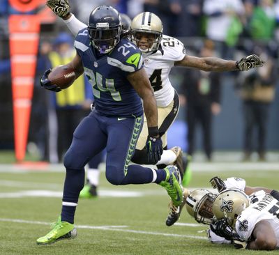 Running back Marshawn Lynch rushed for Seattle playoff-record 140 yards. (Associated Press)