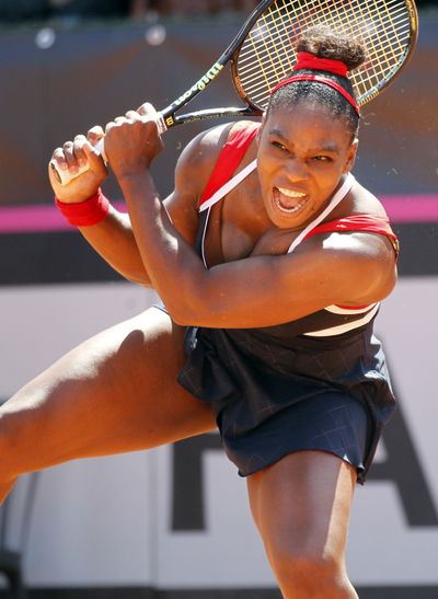 Serena Williams returns the ball to Italy's Sara Errani during a Fed Cup World Group playoff match. (Associated Press)