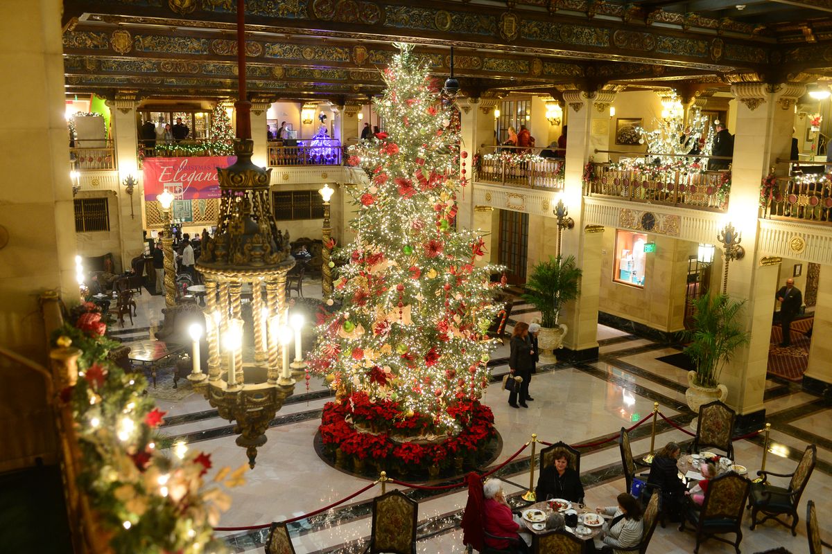 The Davenport Hotel’s holiday tree, plus 12 elaborately decorated entries, light up the lobby at Christmas Tree Elegance in 2016.  (Jesse Tinsley/The Spokesman-Review)