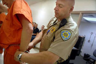 
Kootenai County Sheriff Deputy Christian May  prepares to transport inmates from Kootenai County Jail to court in Coeur d'Alene on Monday.
 (Photos by Holly Pickett / The Spokesman-Review)