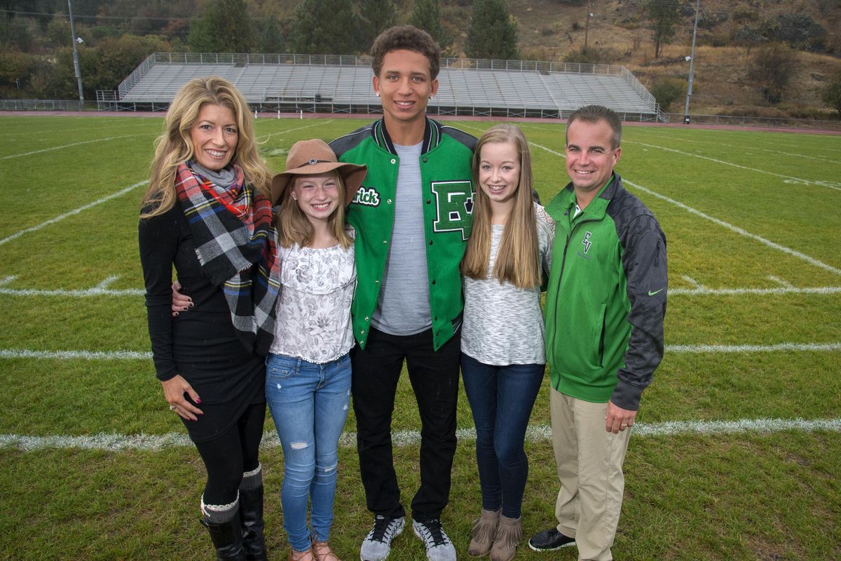 East Valley football player Rodrick Jackson, center, has committed to play football at Washington State University. (Colin Mulvany / The Spokesman-Review)