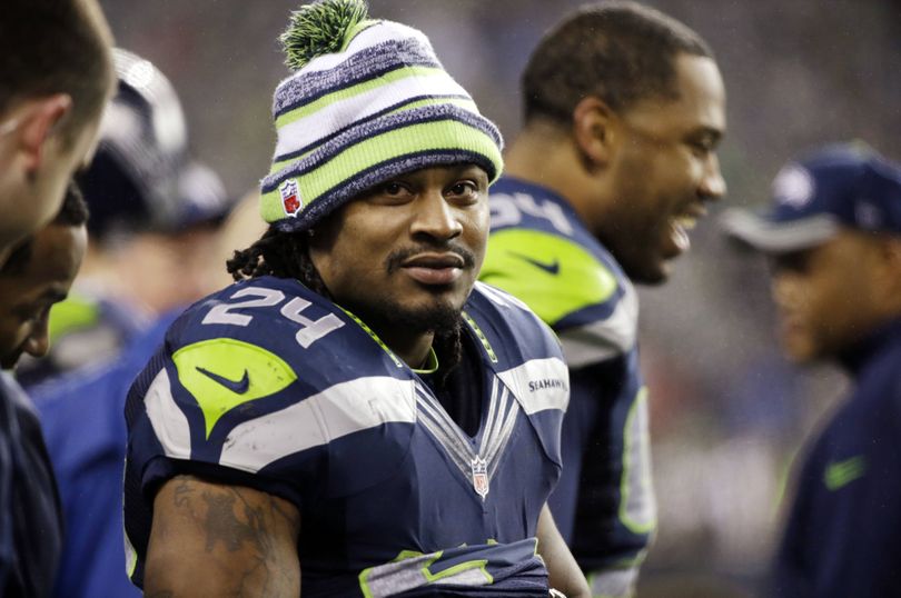 Seattle Seahawks running back Marshawn Lynch, who scored a career-high 17 total touchdowns in 2014, will make $12 million for 2015. (Associated Press)