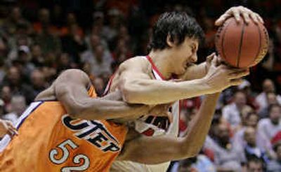 
UTEP's Will Kimble (52) fights for the ball with Utah forward Andrew Bogut. 
 (Associated Press / The Spokesman-Review)