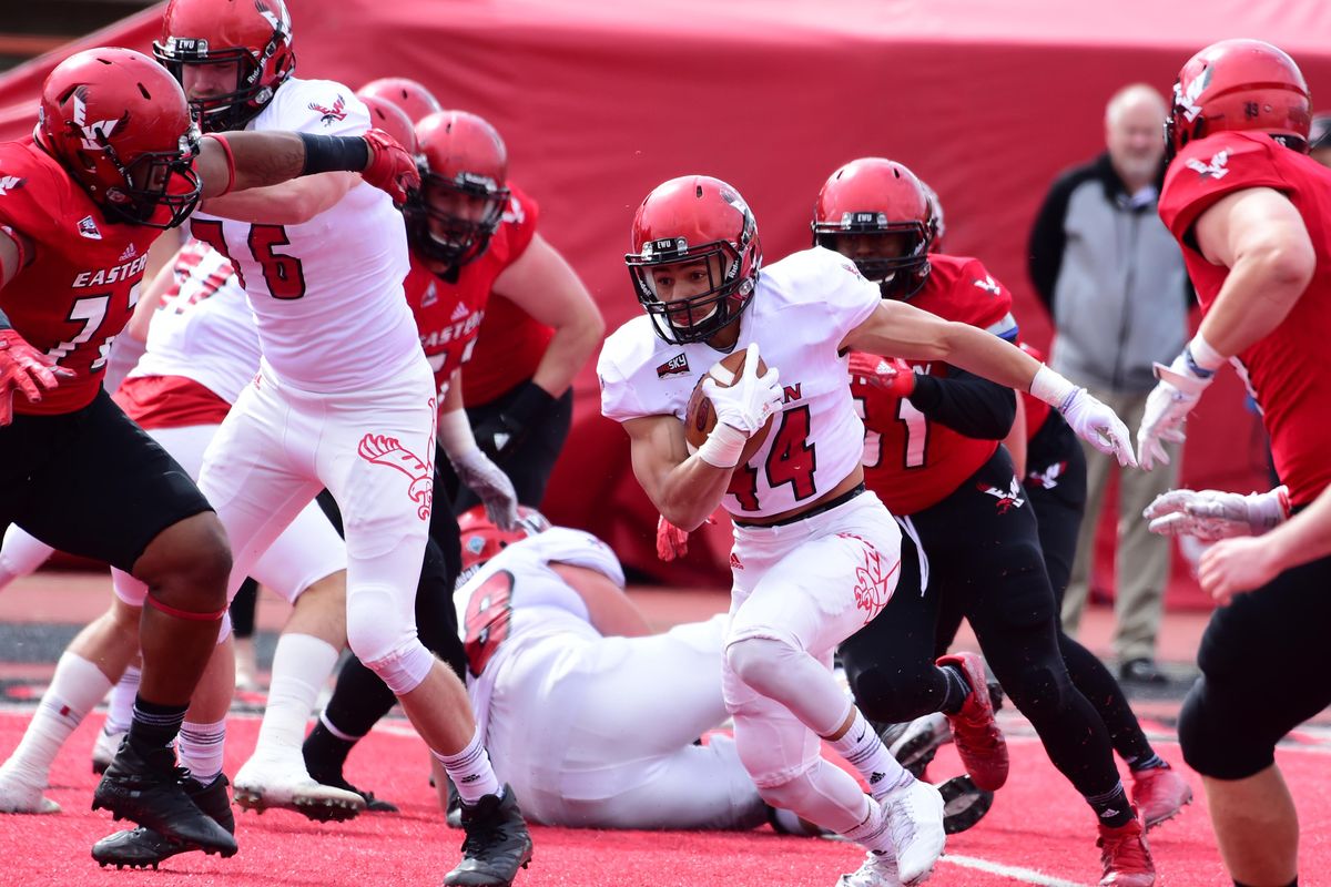 EWU running back Dennis Merritt hits a hole on the run during the annual Red-White game at Eastern Washington University Saturday, April 18, 2018. The White team won 17-0. (Jesse Tinsley / The Spokesman-Review)